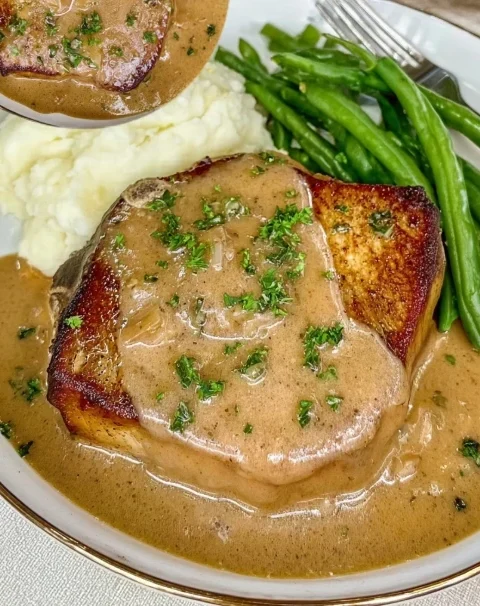 Golden Pork Chops Smothered Recipe Best Smothered Golden Pork Chops Golden Pork Chops With Gravy Easy Golden Smothered Por...