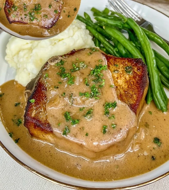 golden pork chops smothered